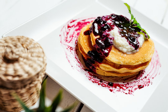 Pancakes. Stack of pancakes topped with berry jam