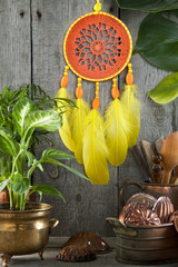 Orange yellow dream catcher on gray