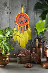 Orange yellow dream catcher on gray