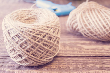 Supplies for decorating a glass bottle. Ecological twine, grue gun and other. Rustic style. Handmade gift for celebrations such as Christmas.