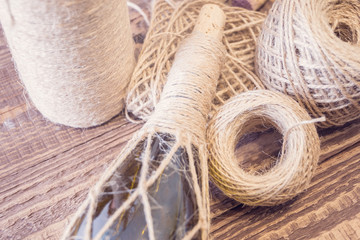 Supplies for decorating a glass bottle. Ecological twine, grue gun and other. Rustic style. Handmade gift for celebrations such as Christmas.