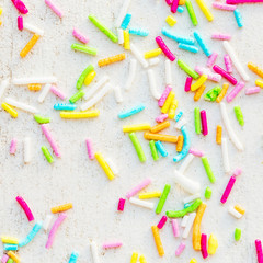 Sugar sprinkles on a white background as  decoration for cake and bakery. 