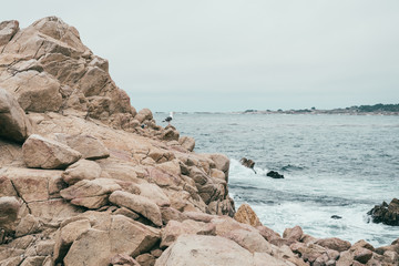 scenery of a beach with stones and sea