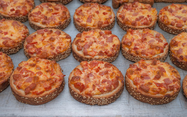Quick Easy Snack. Sesame Bread Baked With Salami And Cheese On Oven Tray. Mini Pizza