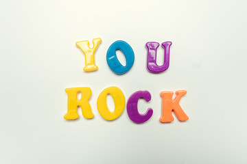You rock compliment in colorful letters close up