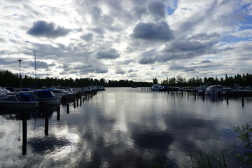 Fototapeta premium Scenic clouds over a lake in Finland