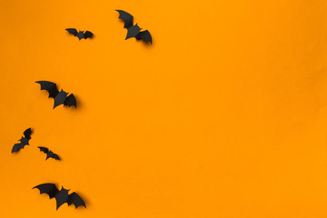 halloween and decoration concept - paper bats flying