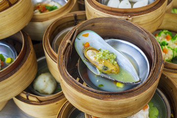 Mussel With Seafood Sauce in Various Dim Sum on the Table, Steamed Traditional Chinese Cuisine Food