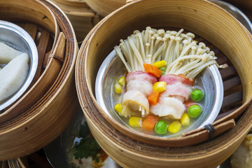 Golden Needle Mushroom with Bacon in Various Dim Sum on the Table, Steamed Traditional Chinese Cuisine Food