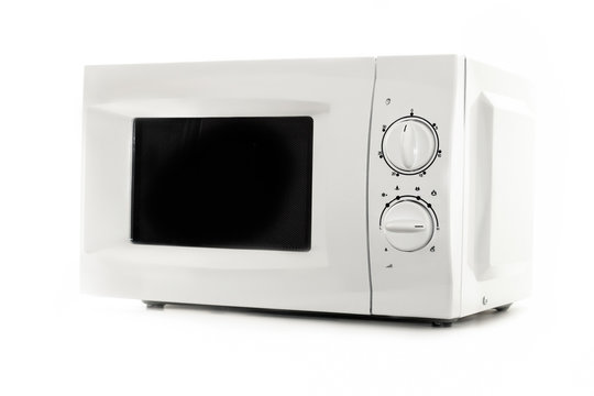 Microwave oven close up isolated on white background. Kitchen equipment. Kitchen and household appliances