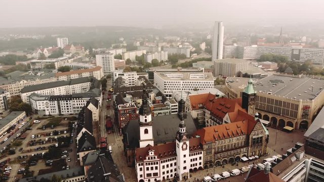 A soft camera flight over the central city of Chemnitz in Eastern Germany. The townhall and the market can be seen on a cloudy day.