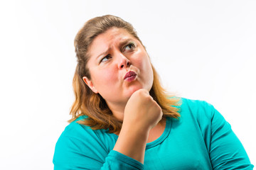 Close-up of fatty woman thinking against white background