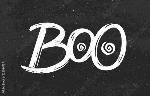“Boo text on black chalkboard background. Hand drawn lettering for