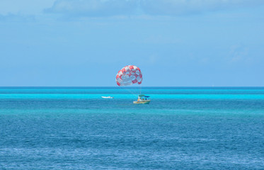 Boat with parachute on the Caribbean sea in Cancun