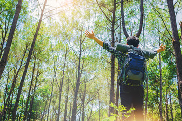 Freedom hiker with backpack open arms enjoy the nature.