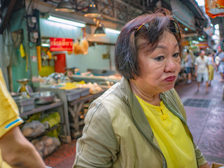 Obraz premium Beauty asian old women very happy in down town of bangkok china town in bangkok city thailand,thailand travel