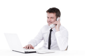 business man talking on the phone and works with laptop