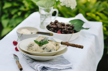 Homemade traditional Russian Ukrainian dumplings, vareniki with cherries