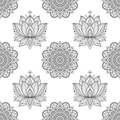 Seamless decorative pattern in ethnic oriental style. Mandala and Lotus flower in mehndi style.