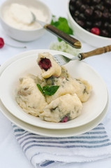 Homemade traditional Russian Ukrainian dumplings, vareniki with cherries