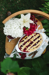 Homemade cherry pie on rustic background