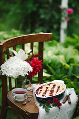 Homemade cherry pie on rustic background