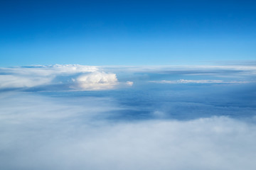 Blue sky and clouds background with lots of copy space.