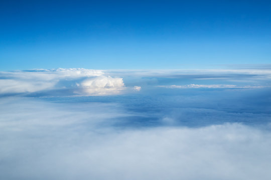 Fototapeta Blue sky and clouds background with lots of copy space.