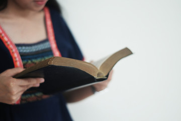 A woman reading the Bible.