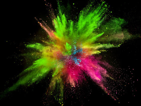 Colored powder explosion on black background.