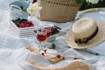 Picnic wicker basket with food on on the grass. Picnic concept.