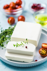 Feta cheese with herbs and olive oil. Selective focus, space for text.