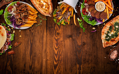 Top down view on traditional turkish meals on vintage wooden table. - obrazy, fototapety, plakaty
