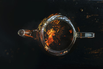 glass of wine and bottle of wine on black background