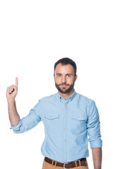 Naklejka premium man in blue shirt pointing up isolated on white