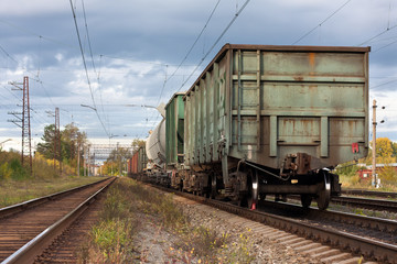 Plakat freight train stands on the railway tracks