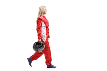 Fotobehang Vrouwelijke racer die loopt en een helm vasthoudt © Ljupco Smokovski