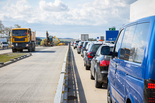 Cars line up on the freeway due to road construction