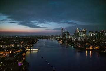 Fototapeta na wymiar A dusk over a skyline of London with the river Thames.