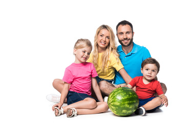 Fototapeta na wymiar happy parents with children and watermelon isolated on white