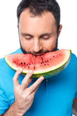 man biting watermelon isolated on white