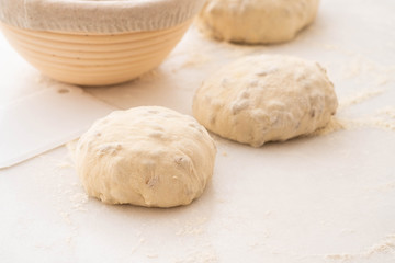 Fototapeta na wymiar Balls of dough covered with wheat flour ready for baking. Copy space.