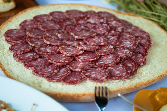 Genuine Italian salami as an appetizer at a party