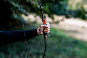 Archery. Archer exercise with the bow. Sport, recreation concept