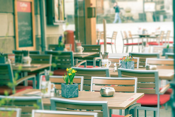 Street view with cafe terrace during the morning in European city