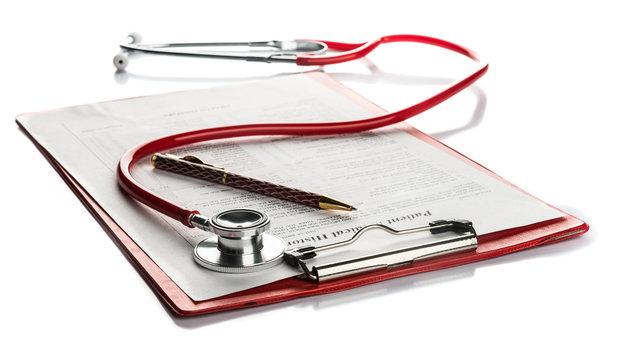 medical history with stethoscope and pen