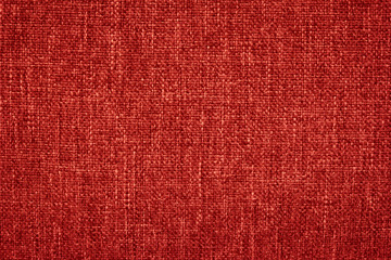 Red canvas texture for background with visible fibers. 
