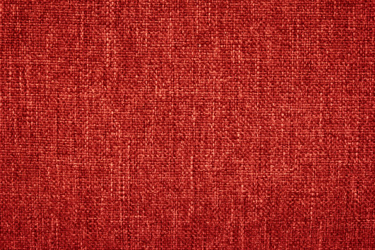 Red canvas texture for background with visible fibers. 