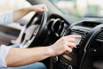 Man Using Gps Navigation System In Car