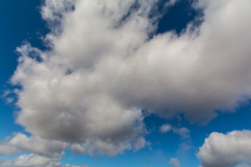 A big cloud in the blue sky.
